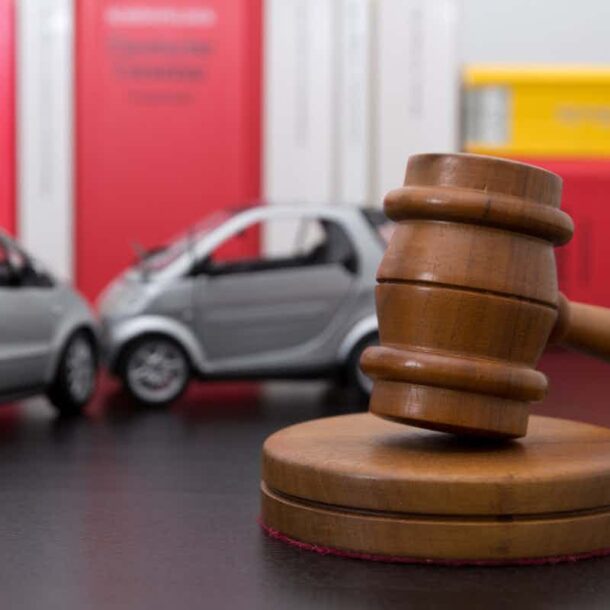 auto accident in the background with a gavel in the front