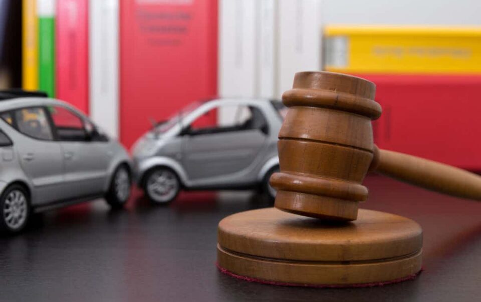 auto accident in the background with a gavel in the front